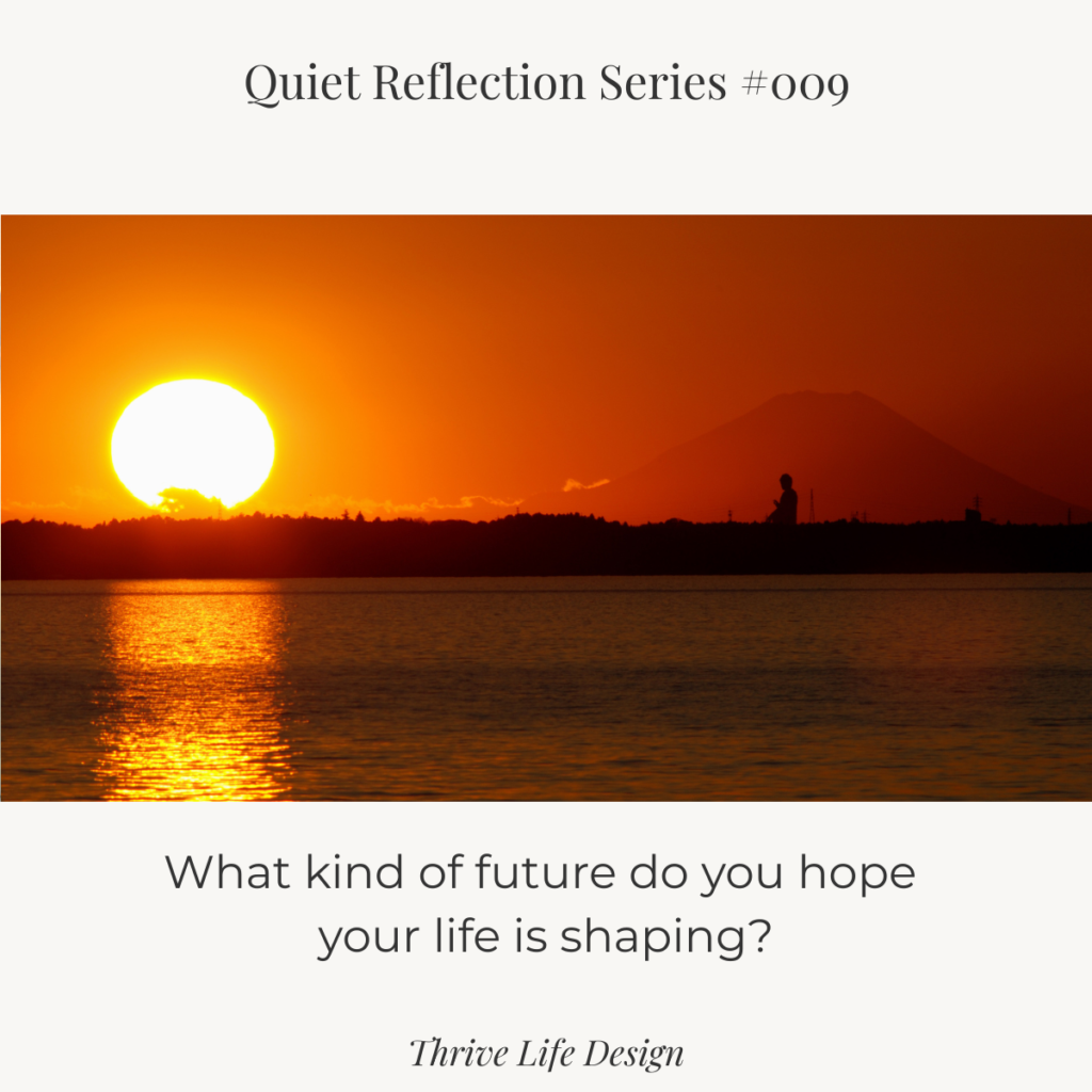 Sunrise over a lake in Ibaraki with Mount Fuji and Ushiku Buddha reflected in the water.