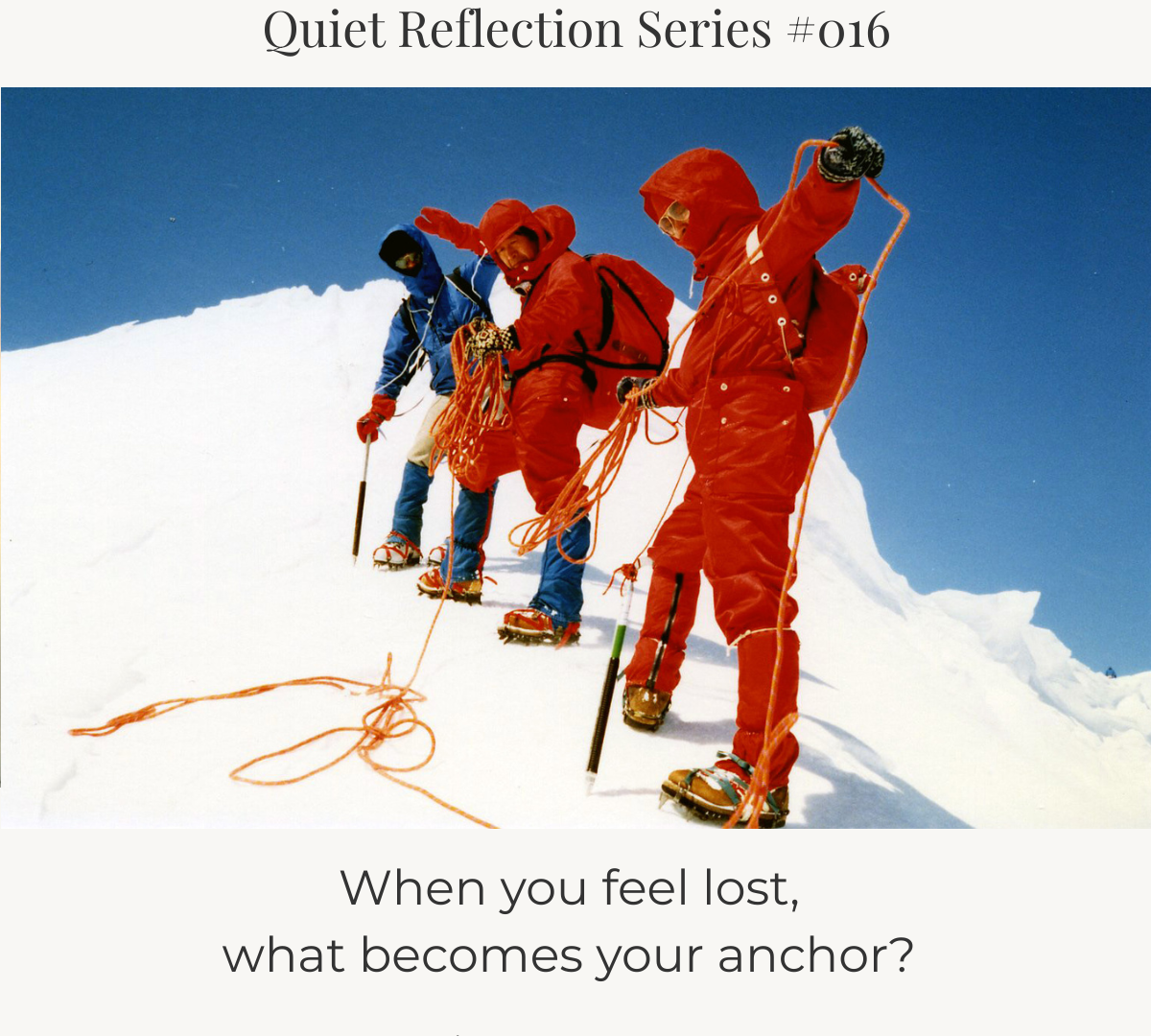 Mountain climbers walking in a line along a snowy slope, linked by a rope.