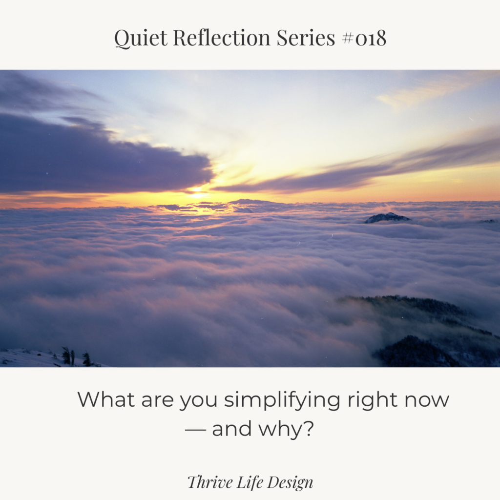 Sunset sky glowing orange behind a dramatic, waterfall-like cloud formation, with layered clouds and soft light spreading across the horizon.